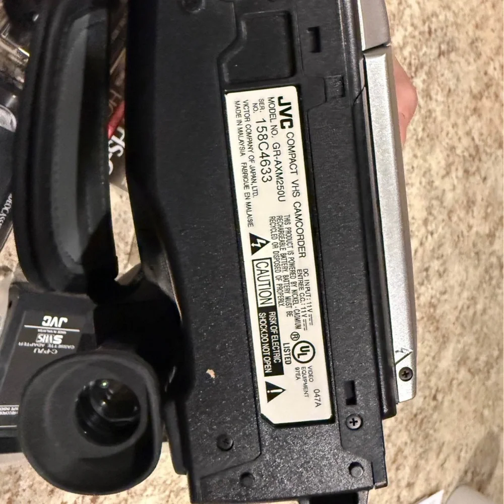 JVC Gray Camcorder with VHS-C Tapes